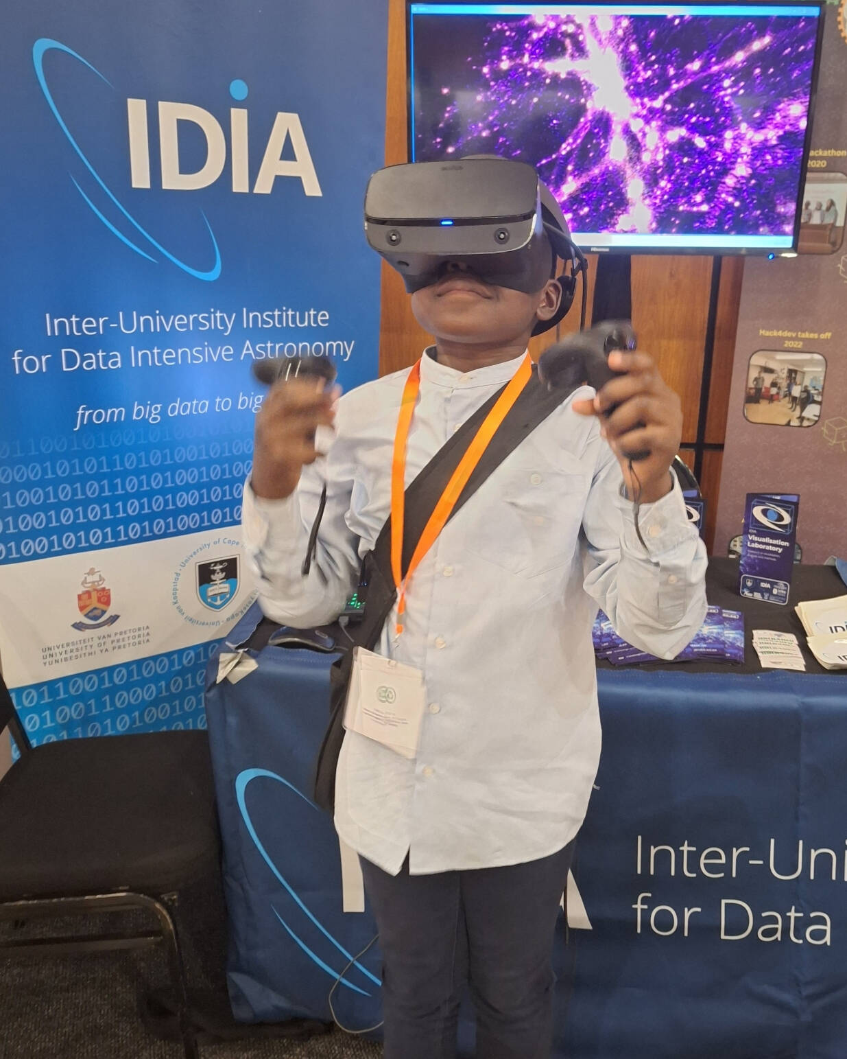 Child using virtual reality headset during astronomy outreach activity