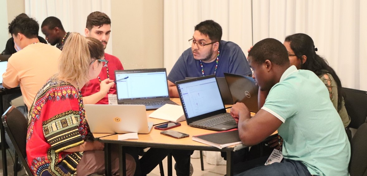 Participants working together at an IDIA-supported hackathon